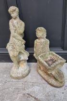 A composition stone figure of a lady, 89cm high; together with another similar wheelbarrow figure,