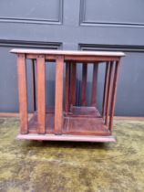 A small antique mahogany table top revolving bookcase, 34.5cm wide.