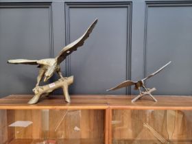 Two brass eagles, largest 61cm wide.