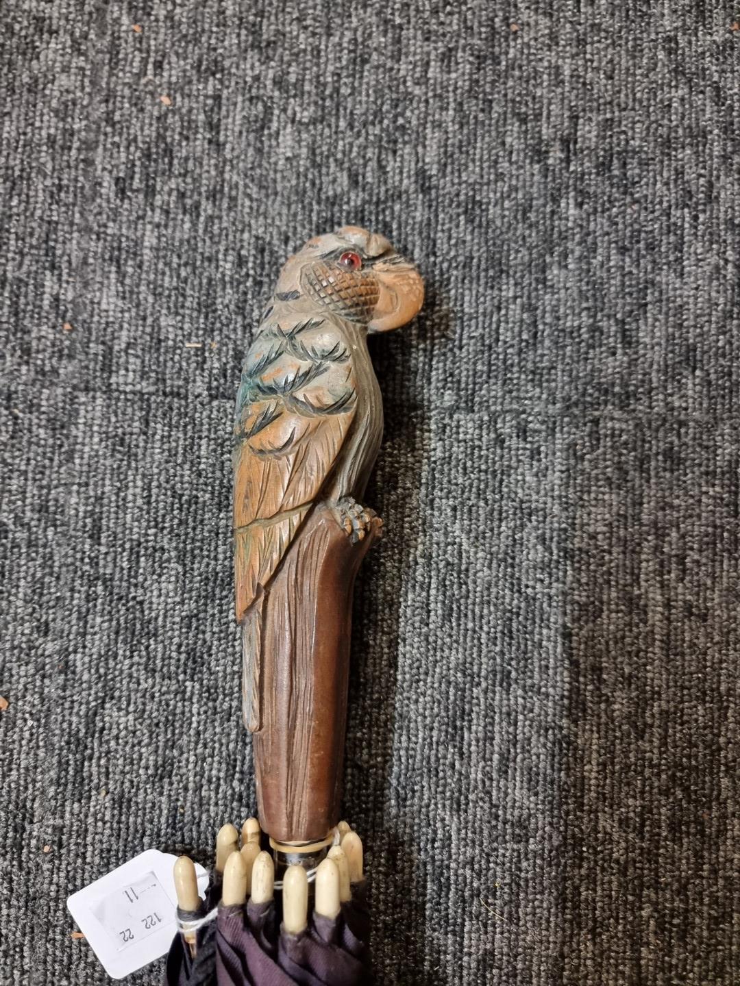 A carved wood novelty parrot handled parasol. - Image 2 of 2