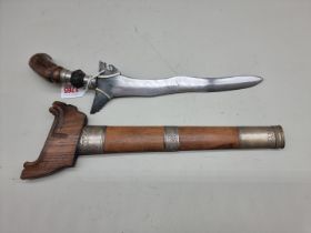 A Malaysian kris and scabbard, with 28cm blade.
