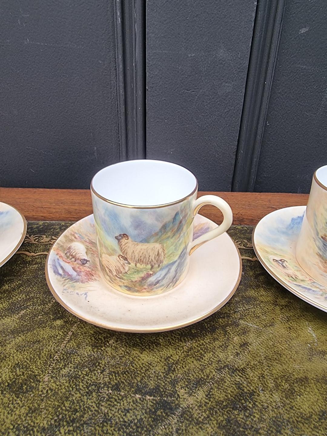 A set of six porcelain coffee cans and saucers, each finely painted with sheep by F Clark. F Clark - Image 3 of 11
