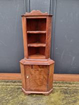 Miniature furniture: a mahogany and line inlaid standing corner cupboard, 31.5cm high.