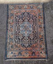 A Persian rug, having central diamond medallion, with floral borders, 200 x 135cm.