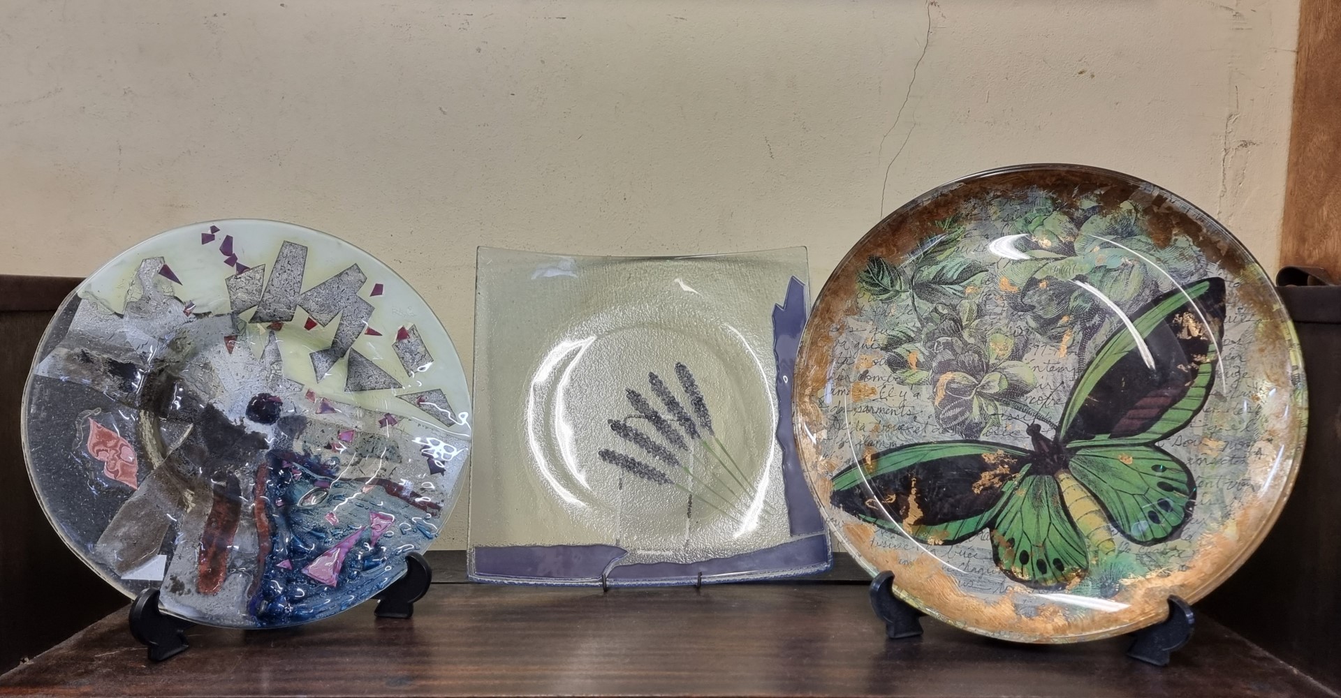 Three decorative glass plates, one inscribed Wilder, largest 33cm. (3)