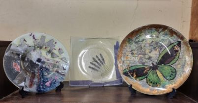 Three decorative glass plates, one inscribed Wilder, largest 33cm. (3)