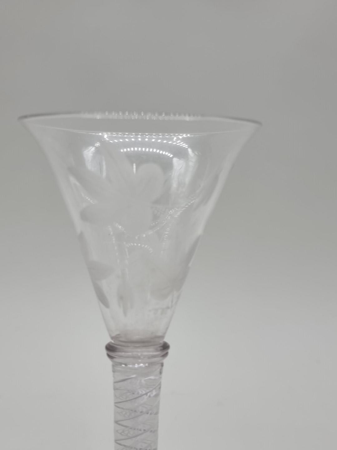An 18th century opaque twist wine glass, the bowl etched with leaves, 18cm high. - Image 4 of 7