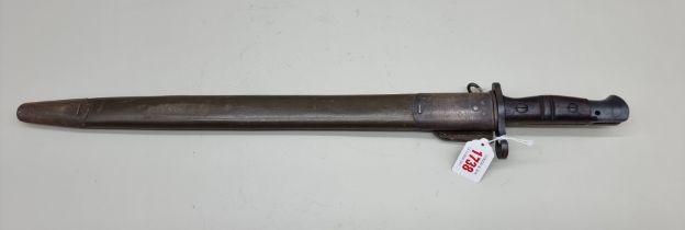 A World War I US bayonet and scabbard, by Remington, dated 1917.