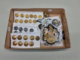 A quantity of military buttons and badges.
