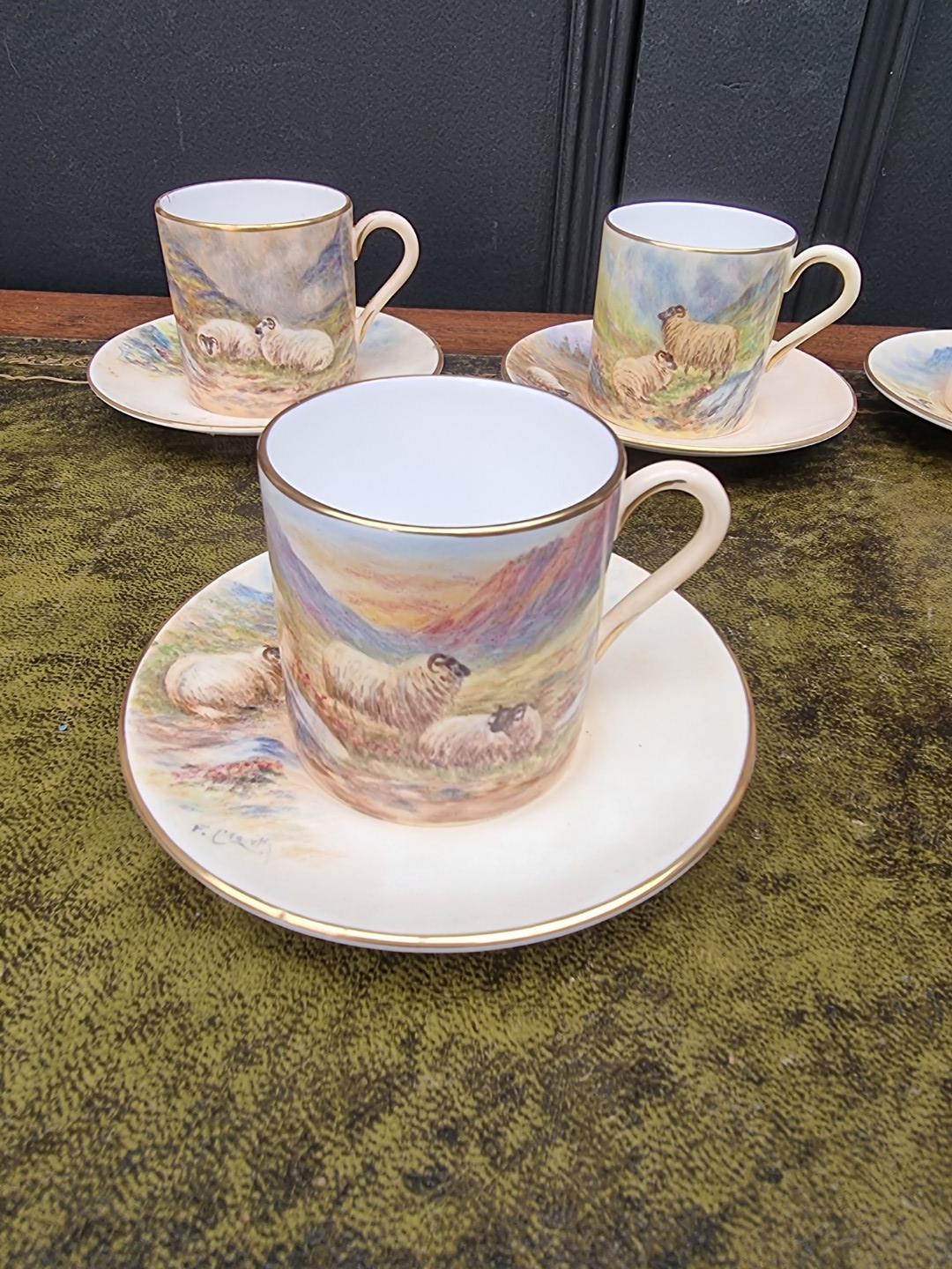 A set of six porcelain coffee cans and saucers, each finely painted with sheep by F Clark. F Clark - Image 6 of 11