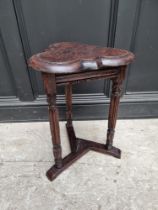 A Gothic style oak trefoil table, 39cm wide.