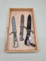 Three Hitler Youth daggers, one with sheath, (in poor condition).