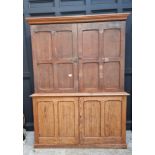 A Victorian pitch pine cabinet, with panelled doors, 216cm high x 183cm wide.