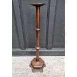 An oak torchere, with hexagonal base, 98cm high.