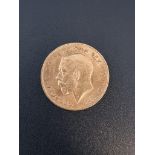 Coins: a George V 1912 gold half sovereign.