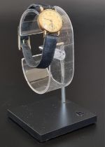 A vintage Eterna yellow metal manual wind ladies wristwatch, 19mm, stamped 14k, on a black leather