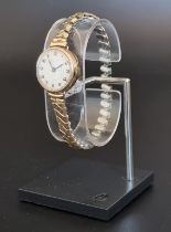 A vintage 9ct gold ladies wristwatch, on a later expanding plated bracelet.