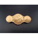 Coins: a Victoria 1887 gold double sovereign and two Victoria gold half sovereigns, in a yellow