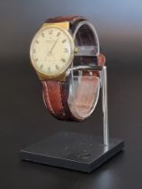 A vintage National Watch yellow metal manual wind wristwatch, stamped 18k, 34mm, Serial No.333809,
