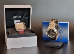 A Seiko Coutura stainless steel and gold plated solar wristwatch, Ref. V172-0AM0; together with a