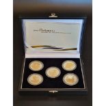 Coins: a 2006 Royal Mint 'Britannia Golden Silhouette Collection', containing five silver proof £2