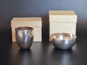 A metal sugar bowl and matching cream, both boxed.