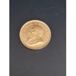 Coins: a 1974 gold krugerrand.