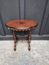 A Victorian burr walnut and ebonized oval occasional table, 67cm wide.