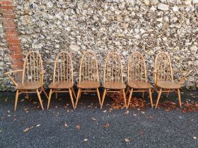 A set of six vintage Ercol 'Quaker' dining chairs, to include a pair of elbow chairs.