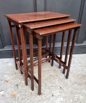 A small reproduction mahogany two tier occasional table, 34.5cm wide; together with a nest of