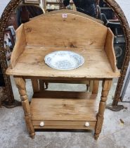 A Victorian pine washstand, 72cm wide; with associated Victorian blue and white pottery bowl.
