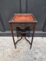 A small late Victorian carved mahogany square bijouterie table, with blind fret decoration, 39.5cm