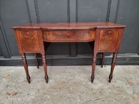 A small George IV figured mahogany and ebony strung bowfront sideboard, 122cm wide.