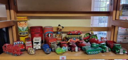 Vintage Tinplate: a group of vintage tinplate items, to include Minic vehicles, money boxes,