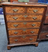 A burr walnut, feather and crossbanded television cabinet, 71.5cm wide.