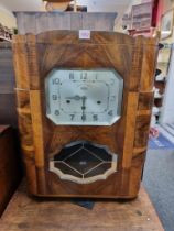 A 1930s walnut wall clock, the silvered dial inscribed 'Girod', chiming on eight straight gongs,