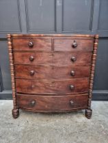 An early Victorian mahogany bowfront chest of drawers, with turned pilasters, 118cm wide.