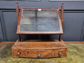 A George III mahogany and crossbanded toilet mirror, 51.5cm wide.