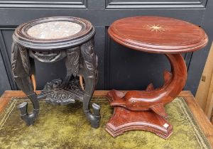 A small carved and ebonised marble top occasional table, with Elephant supports, 51cm high; together