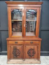 A late Victorian carved walnut bookcase, 123cm wide