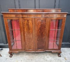 A 1920s mahogany bowfront side cabinet, 153cm wide.