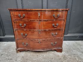 A George III mahogany serpentine chest, the top drawer partially fitted with pigeon holes, 107cm