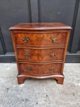 A small reproduction burr walnut serpentine fronted chest, 53cm wide.