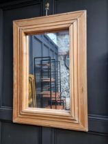 A pine framed wall mirror, 101.5 x 71cm.