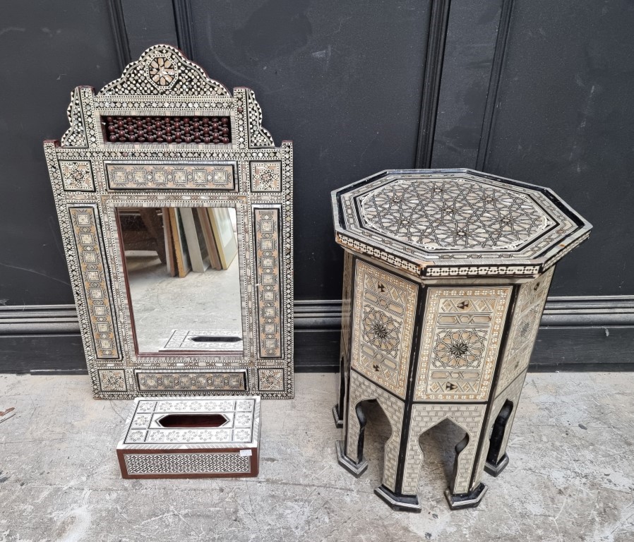 A Moorish mother-of-pearl inlaid octagonal occasional table, 40cm wide; together with a similar wall