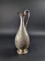 A Victorian silver claret jug, by Walter & John Barnard, London 1890, engraved with foliate