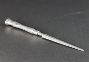A white metal handled page turner, stamped '925', 32cm long.