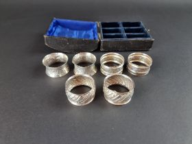 A cased set of six pairs of silver napkin rings, by William Devenport, Birmingham 1894, 51g.