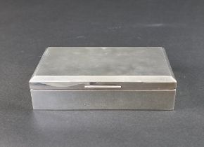 A silver engine turned cigarette box, by Walker & Hall, Birmingham 1955, 14.5cm wide.