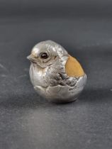 An Edwardian silver novelty chick pin cushion, by Sampson Mordan & Co Ltd, Chester 1907, 4cm tall.